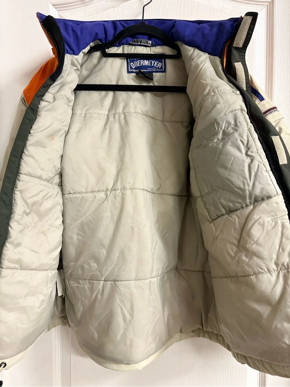 Obermeyer Orange and Cream Performance Jacket with Blue Trim